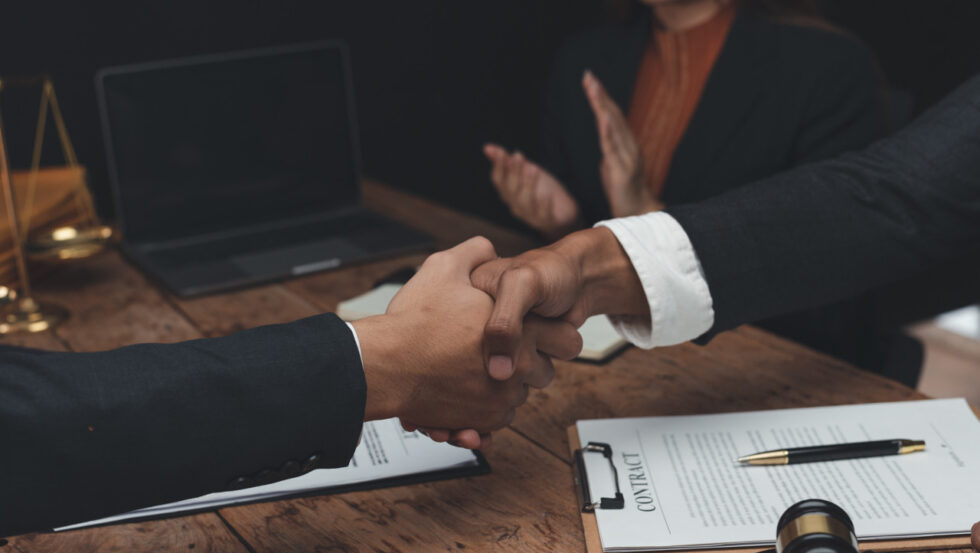 client-shaking-hands-with-a-lawyer-or-discusses-a-2023-02-21-18-40-20-utc client-shaking-hands-with-a-lawyer-or-discusses-a-2023-02-21-18-40-20-utc